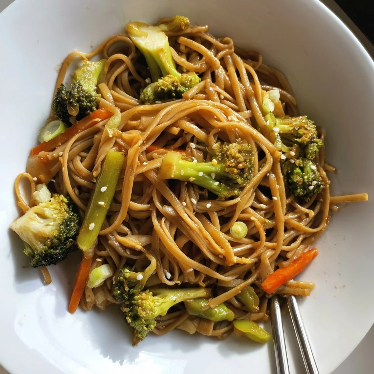 Delicious veggie stir-fry noodles packed with vibrant vegetables and savory Asian flavors.  