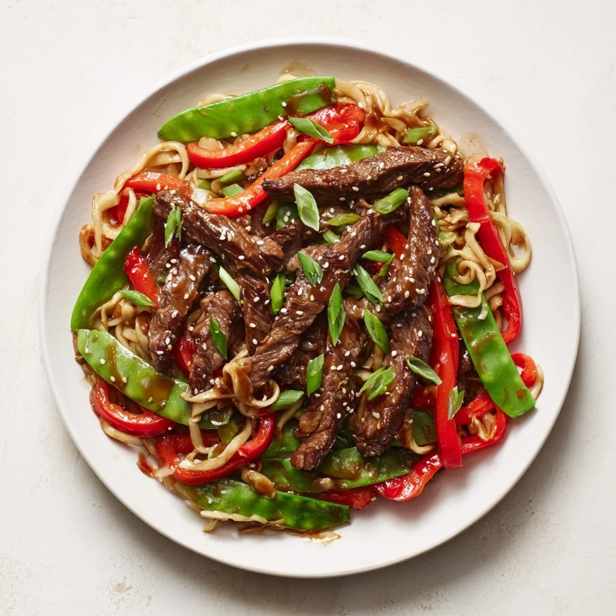 A flavorful Teriyaki Beef & Noodle Bowl, featuring tender beef and vibrant vegetables in a rich, sweet sauce.