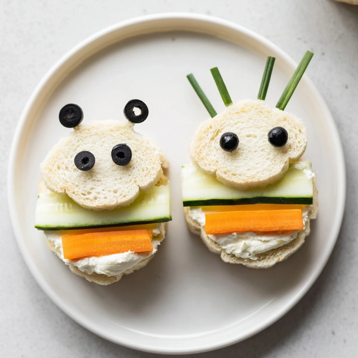 Vibrant bee sandwich cutouts encircled by fresh fruits and vegetables, ready to eat.