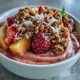Cool creamy guava and mango smoothie bowl for a refreshing breakfast or snack topped with chia seeds.