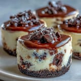 Delicate mini cheesecake bites with rich Oreo crust ready for topping.