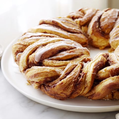 Golden-brown Cinnamon Swirl Christmas Tree Bread, swirled with cinnamon, perfect for holiday breakfasts.