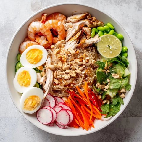 Vibrant Asian Fusion Noodle Bowl Board: imagine colorful vegetables, chicken, shrimp, and dipping sauces.