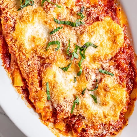 Golden, bubbly Four Cheese Baked Pasta, a cheesy Italian-American comfort food casserole.