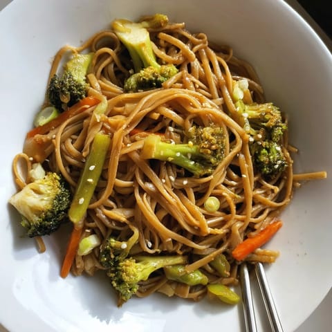 Delicious veggie stir-fry noodles packed with vibrant vegetables and savory Asian flavors.  