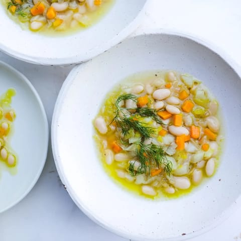 Creamy, chunky Simple White Bean and Fennel Soup: a Mediterranean vegetarian delight in a bowl.