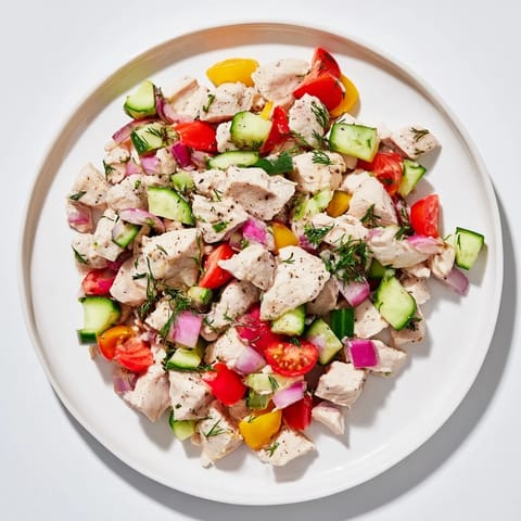 A vibrant bowl of Cucumber and Chicken Clean Shaker salad, perfect for a light, healthy lunch.