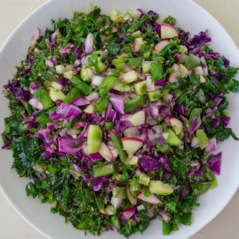This vibrant Green Goddess Detox Cabbage Salad features shredded cabbage and a creamy avocado dressing.