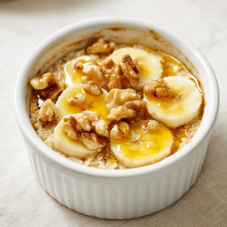 A close-up of warm baked oats ramekins infused with banana, perfect for a cozy morning.