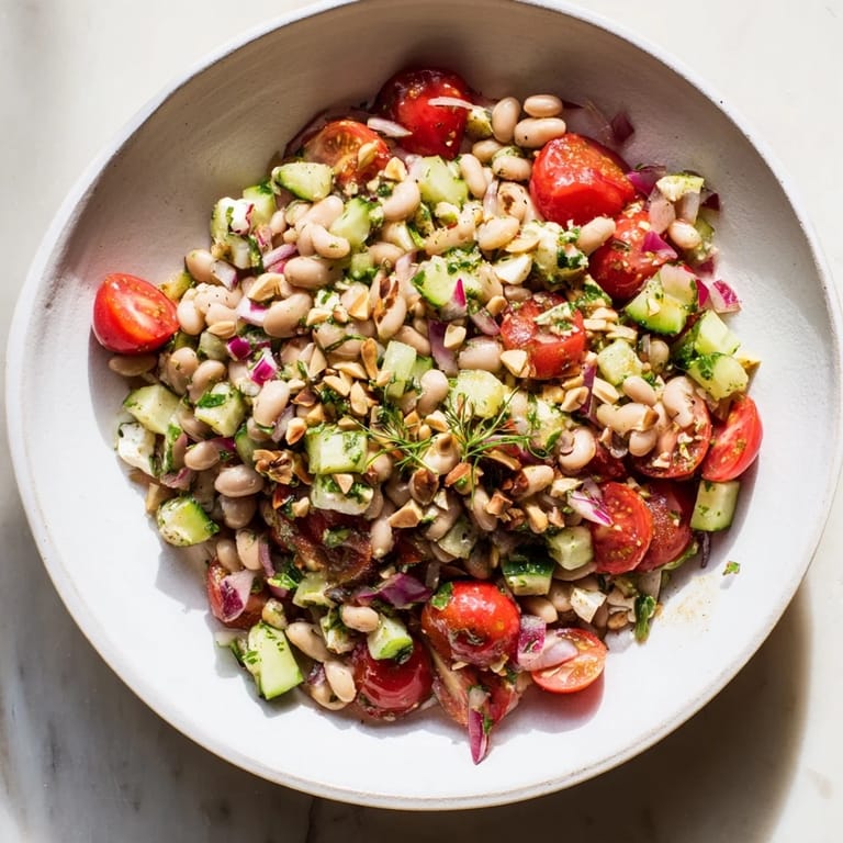 This refreshing Dense Bean Salad recipe shows healthy beans and vegetables, perfect for a light supper.