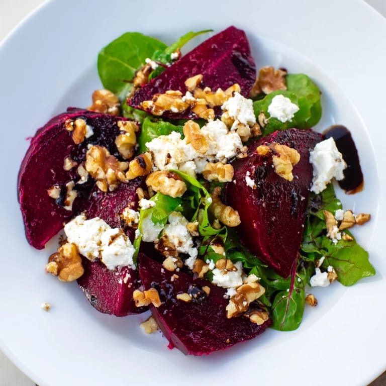 Warm roasted beets mingle with creamy goat cheese in a fresh, colorful salad.