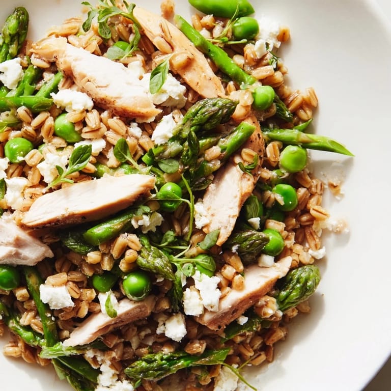 Serve this Warm Spring Farro Chicken Salad warm or at room temperature for a light, protein-packed lunch or refreshing dinner with seasonal spring vegetables.