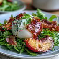 Creamy burrata, sweet peaches, and prosciutto star in this vibrant summer salad.